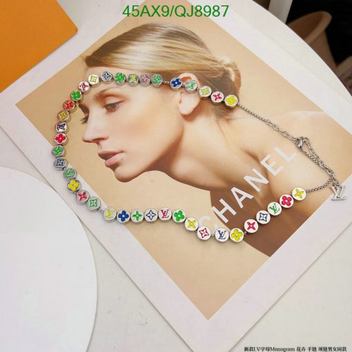 Ad print featuring colorful designer necklace on model.