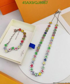 Colorful charm necklace on display with packaging.