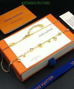 Gold Louis Vuitton charm bracelet with packaging.