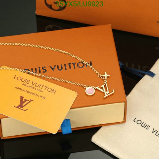 Louis Vuitton necklace on display with packaging.