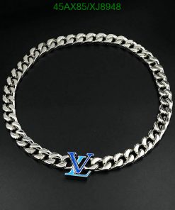 Silver chain necklace with blue "V" pendant.