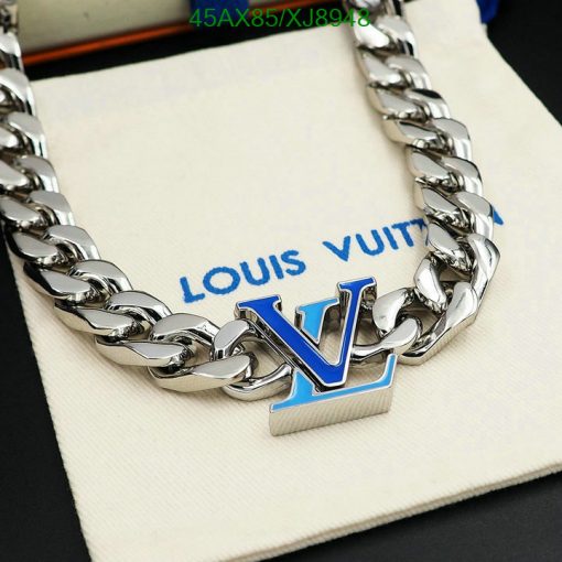 Silver chain necklace on branded cloth.