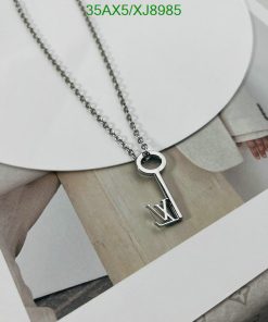 Silver key pendant necklace with letter V design.