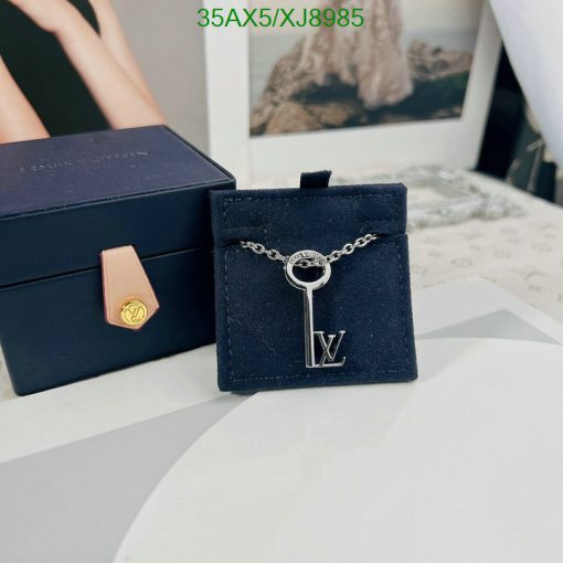 Designer key pendant with brand packaging.