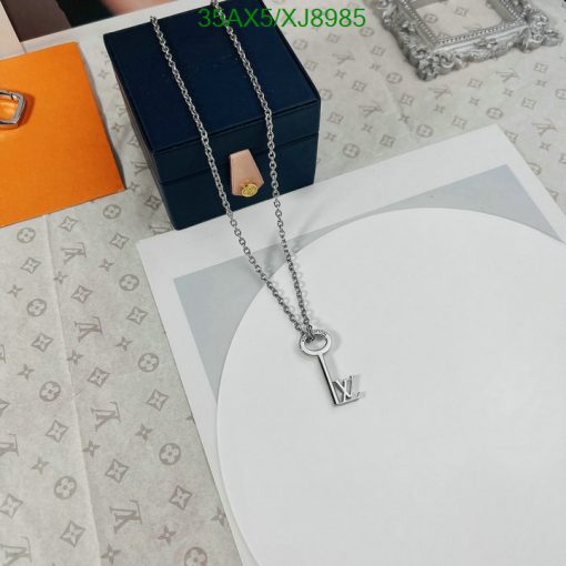 Designer key pendant necklace with branded packaging.