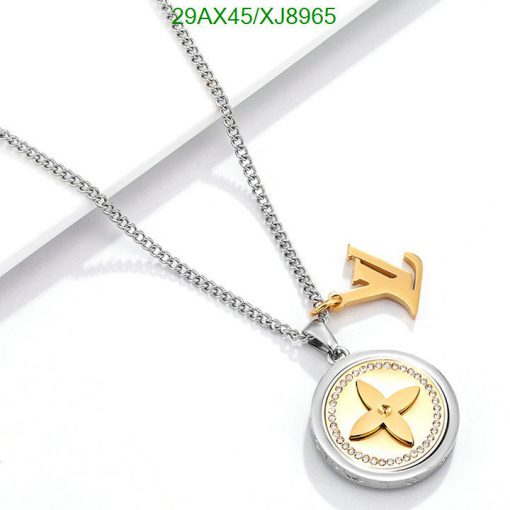 Gold and silver pendant necklace on white.