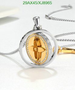 Gold and silver propeller pendant with diamonds, elegant jewelry.