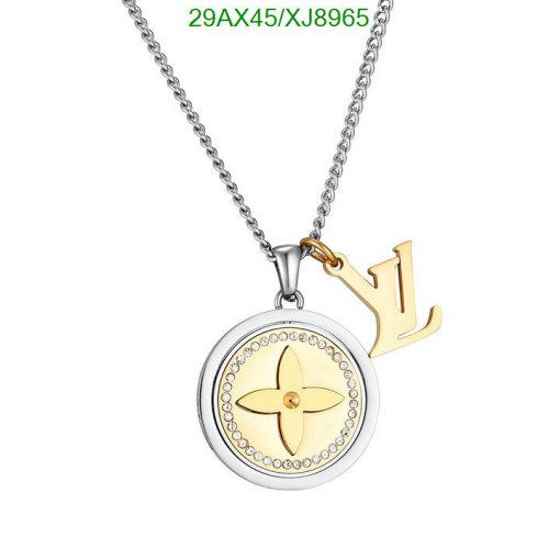 Silver and gold pendant necklace with flower design.