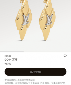 Gold-tone designer logo earrings.