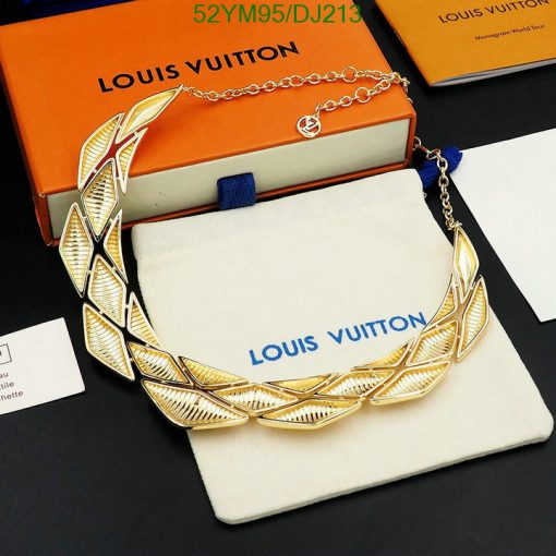 Gold leaf-designed necklace on Louis Vuitton display.