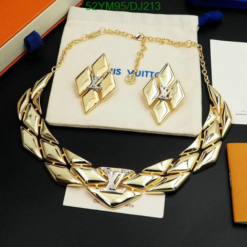 Luxury gold necklace and earrings set on display.