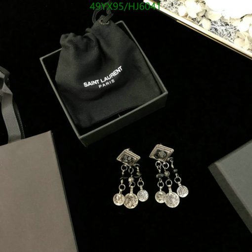 Saint Laurent jewelry display with box and pouch.