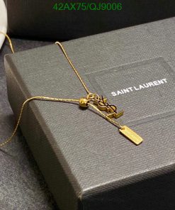 Gold necklace on Saint Laurent box.