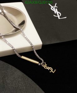 Elegant designer necklace on display with branded packaging.