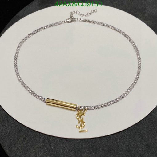 Elegant choker necklace with gold pendant on white display.