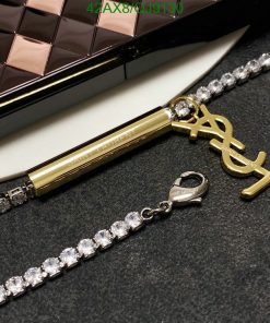 Designer clutch, pen, and diamond necklace.