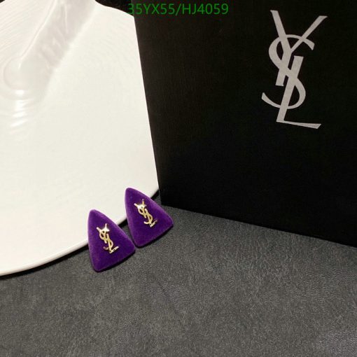 YSL logo earrings on velvet with brand packaging.