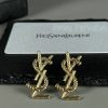 Gold designer cufflinks on display with box