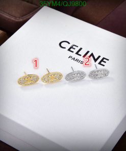 Celine branded earrings on white display.