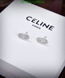 Celine Paris branded silver earrings on display.