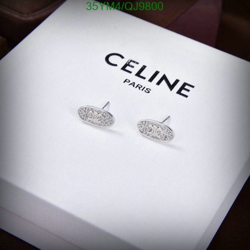 Celine Paris branded silver earrings on display.