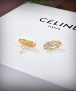 Celine Paris gold stud earrings with crystals on display