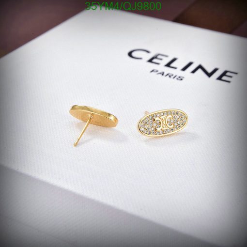 Celine Paris gold stud earrings with crystals on display