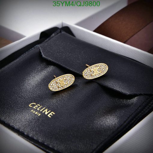 Gold designer cufflinks on black leather case.