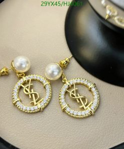 Gold dollar sign earrings with pearls and crystals.