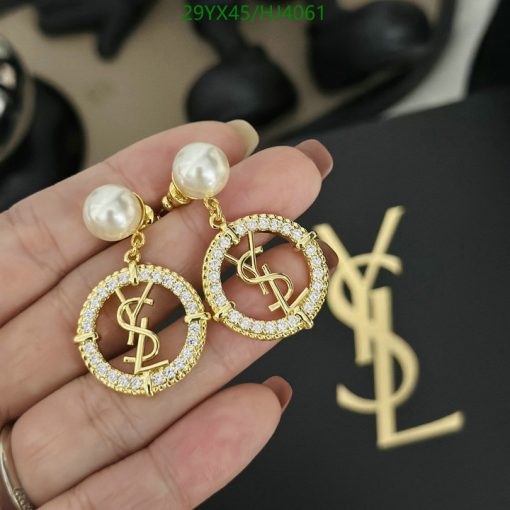 Designer pearl and logo drop earrings.