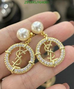 Gold pearl logo earrings with crystals.