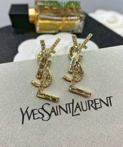 Gold designer logo earrings on card.