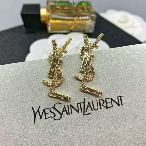 Gold designer logo earrings on card.