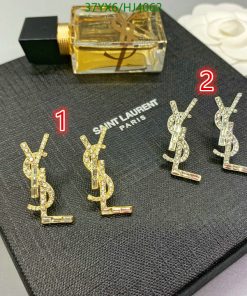 Saint Laurent logo earrings with perfume bottle.