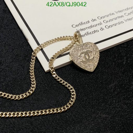 Gold heart-shaped pendant with logo on certificate.