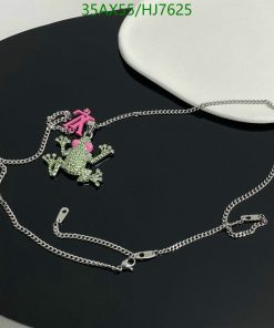 Green rhinestone frog pendant with pink bow on chain.