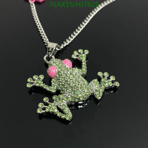 Sparkling green frog pendant with pink accents.