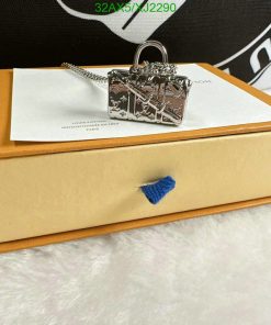 Designer keychain on luxury brand packaging.