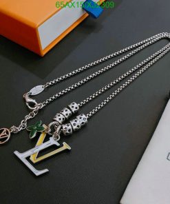 Silver necklace with charms and LV pendant.