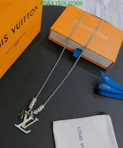 Designer necklace with luxury packaging on table.