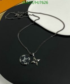 Black pendant necklace with logo on display stand.