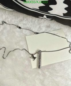 Silver necklace with pendant on white background.