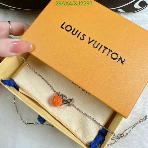 Orange charm necklace in luxury branded box.