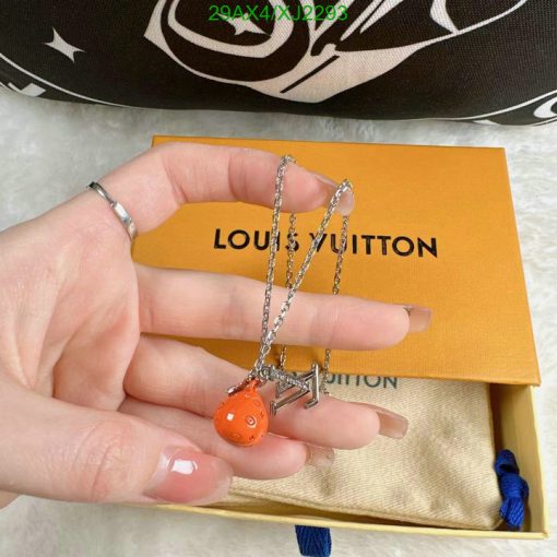 Orange charm on silver chain, Louis Vuitton box.