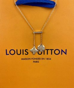 Louis Vuitton necklace on branded orange background.