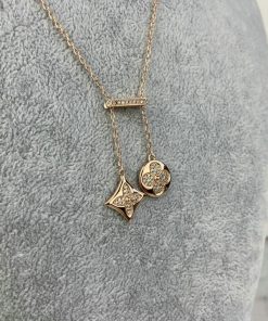 Gold star and flower pendant necklace with diamonds.