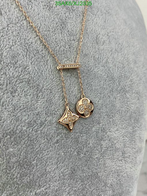 Gold star and flower pendant necklace with diamonds.