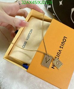 Hand holding Louis Vuitton necklace with box.