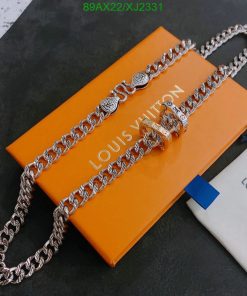 Designer silver chain on brand's orange packaging.