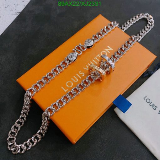 Designer silver chain on brand's orange packaging.